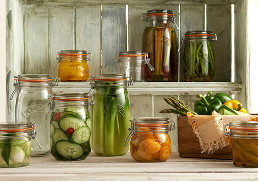 Various glass Kilner jars filled with preserves